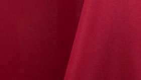 Image of a 108" Round Garnet Poly Tablecloths