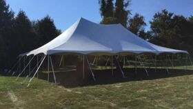 Image of a 40x60 Pole Tent Installed on grass, dirt