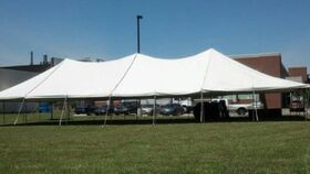 Image of a 40x80 Pole Tent Installed on grass, dirt