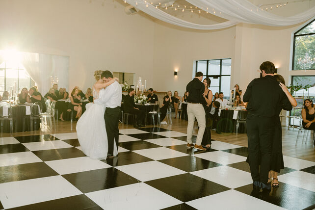 Black and white checkerboard dance floor rental in a Boston ballroom wedding reception